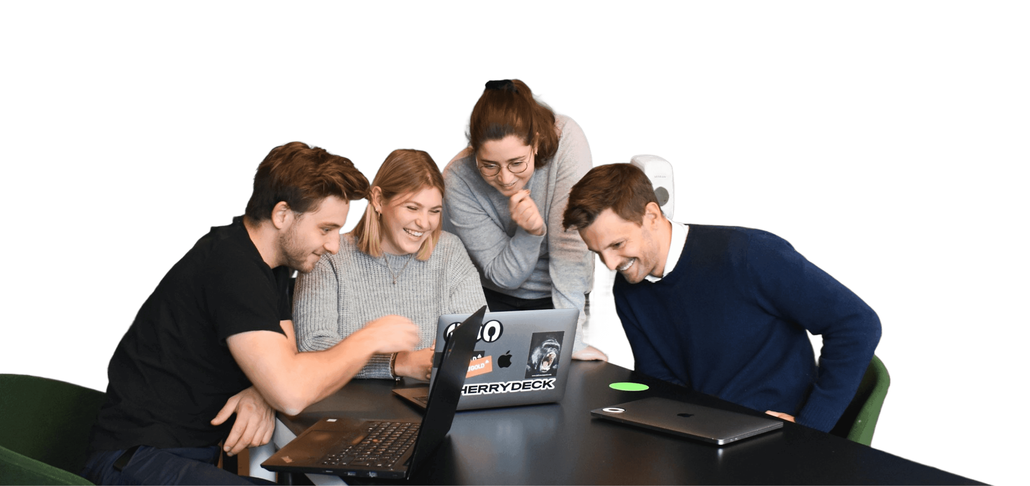 QGR team collaborating around laptops
